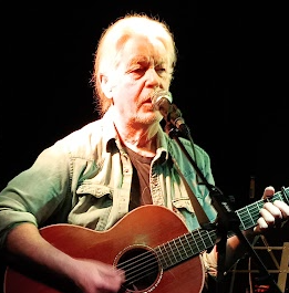 Paddy McCullough playing guitar and singing