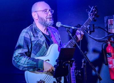 Graham Wheatley playing bass and singing
